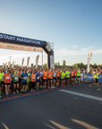 Half marathon finish line scene representing race day achievement, paired with personalized marathon route map wall art.