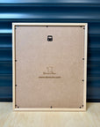 Close-up of the back panel of a Puerto Rico 3D city map wall art frame in natural wood, laser-engraved with “Fait main en France” and www.demurin.com, showcasing authentic French handcrafted quality.