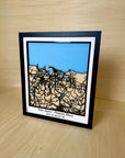 Angled three-quarter view of San Juan Puerto Rico framed 3D city map featuring white precision laser-cut street network, natural wood layers, blue sea detail and engraved coordinates, handmade wall decor.