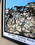 Detailed view of San Juan Puerto Rico framed 3D city map, laser-cut wooden street network with blue sea layer and engraved coordinates, handmade wall decor.